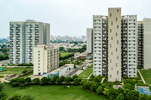 Aerial view of township towers and green landscaping